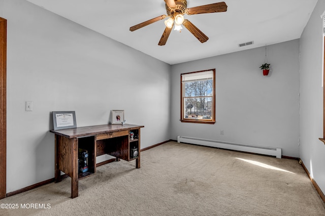 office area with visible vents, a baseboard heating unit, light carpet, ceiling fan, and baseboards