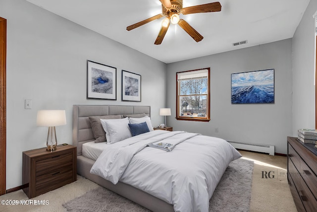 bedroom with visible vents, baseboards, light colored carpet, ceiling fan, and a baseboard heating unit