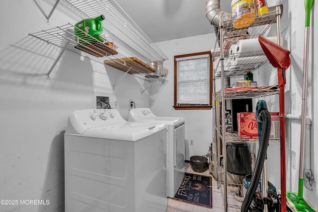 clothes washing area with laundry area and washer and clothes dryer