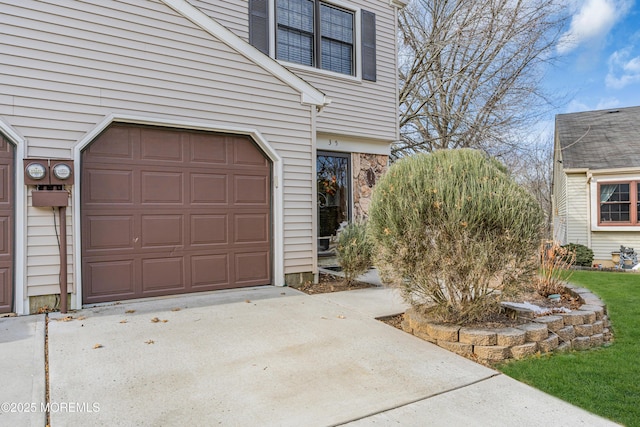 garage featuring driveway