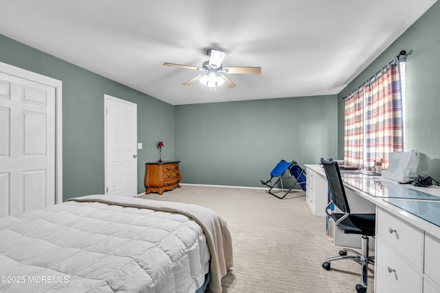 bedroom featuring light colored carpet, ceiling fan, and baseboards