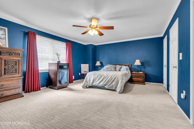 bedroom featuring baseboards, a ceiling fan, crown molding, and light colored carpet