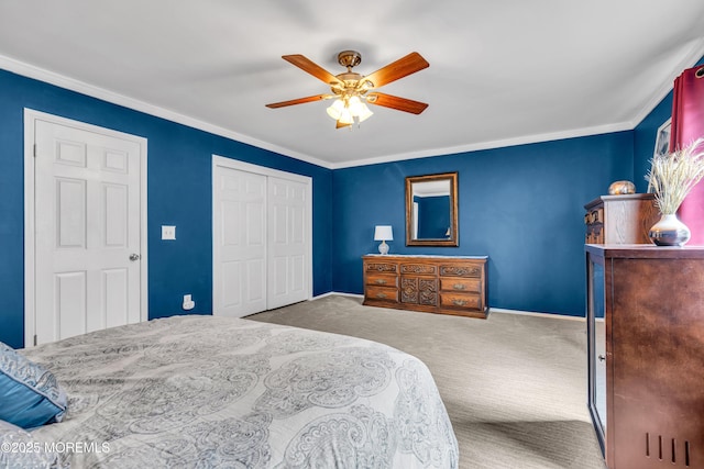 bedroom featuring carpet, crown molding, ceiling fan, and a closet