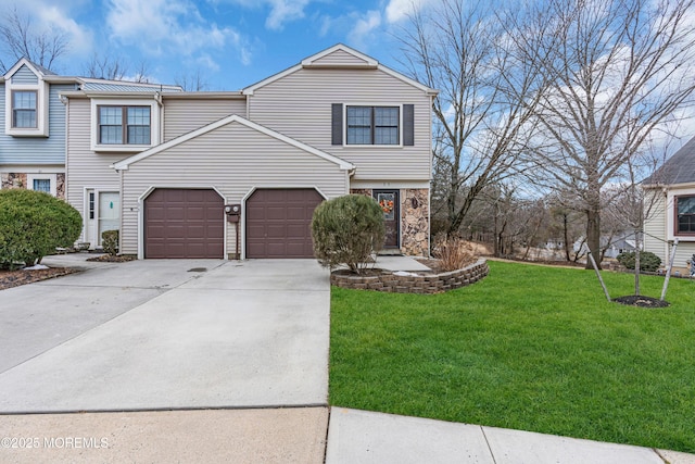 view of front of property featuring a garage, concrete driveway, a front lawn, and stone siding