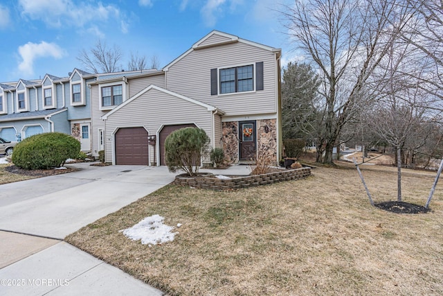 view of front of home featuring a garage, stone siding, driveway, and a front lawn