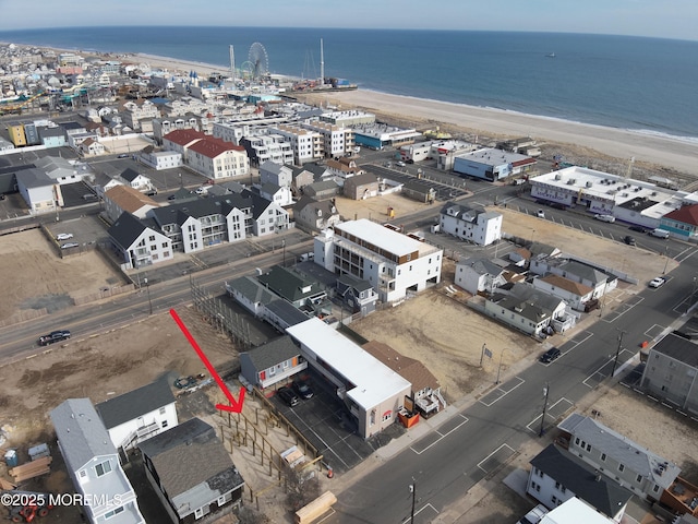 aerial view with a water view, a city view, and a view of the beach