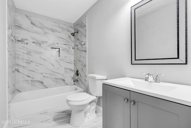 bathroom featuring bathtub / shower combination, toilet, marble finish floor, and vanity