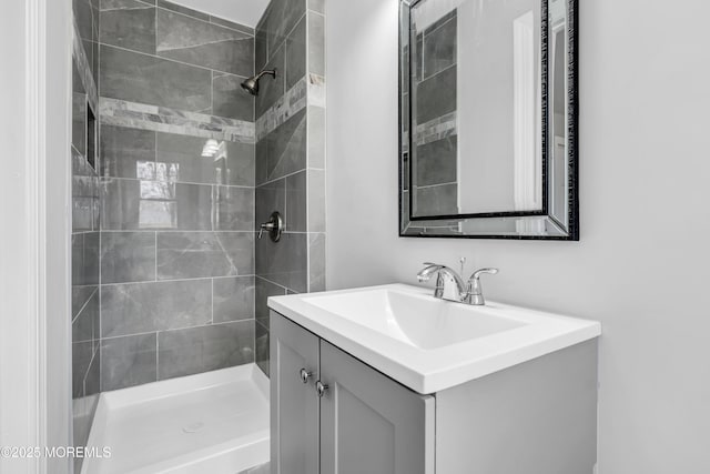 full bath featuring a stall shower and vanity