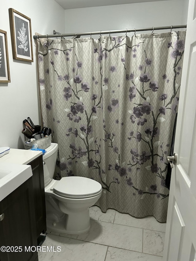 882 Balmoral Ct Unit D, Lakewood, NJ 08701 - full bathroom with marble look tiles, vanity, toilet, and a shower with curtain
