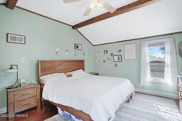 bedroom featuring lofted ceiling with beams, light wood-type flooring, visible vents, and baseboards