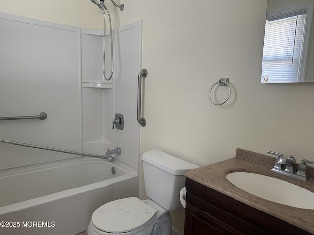 bathroom featuring  shower combination, vanity, and toilet