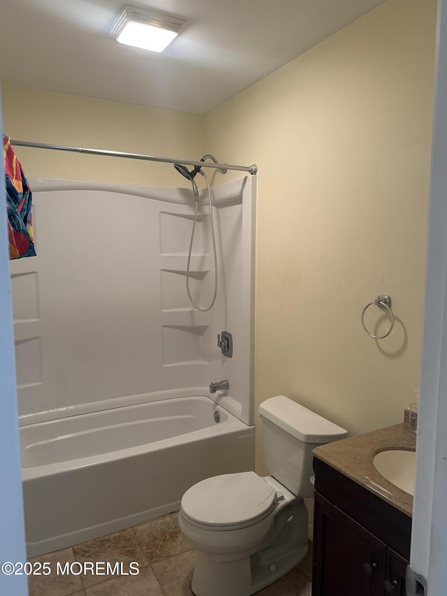 bathroom with shower / washtub combination, tile patterned flooring, vanity, and toilet