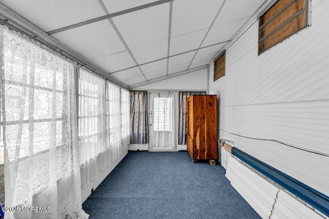 sunroom with lofted ceiling and a drop ceiling