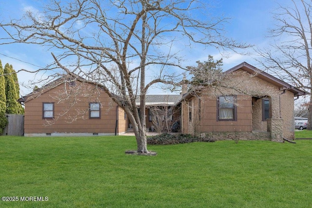 view of front facade featuring a chimney and a front lawn