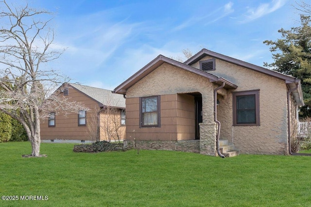 ranch-style house with a front lawn and stucco siding