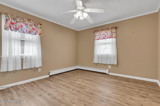 empty room featuring wood finished floors, baseboards, and ornamental molding