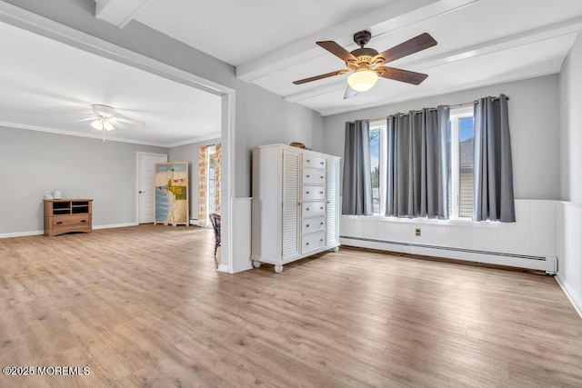 interior space with light wood finished floors, beamed ceiling, and a baseboard heating unit