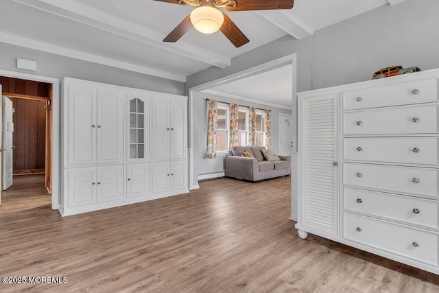 unfurnished bedroom with light wood finished floors, beamed ceiling, a baseboard heating unit, and a ceiling fan