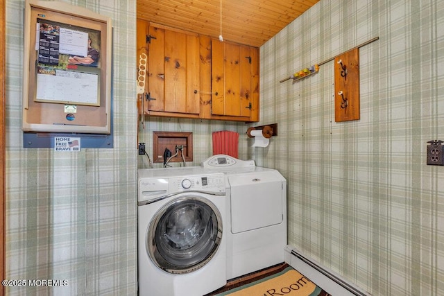 washroom with wallpapered walls, washer and clothes dryer, wood ceiling, cabinet space, and a baseboard radiator