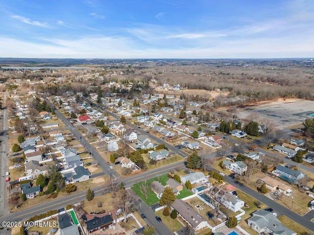 birds eye view of property with a residential view