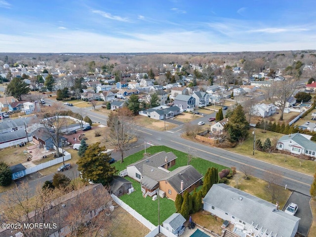 birds eye view of property with a residential view