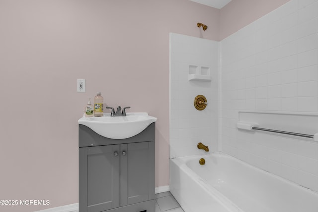 bathroom with baseboards, bathing tub / shower combination, vanity, and tile patterned flooring