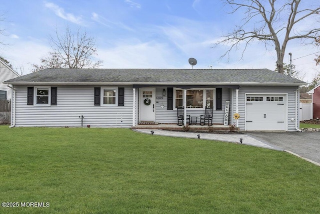 ranch-style home featuring aphalt driveway, a garage, a porch, and a front lawn