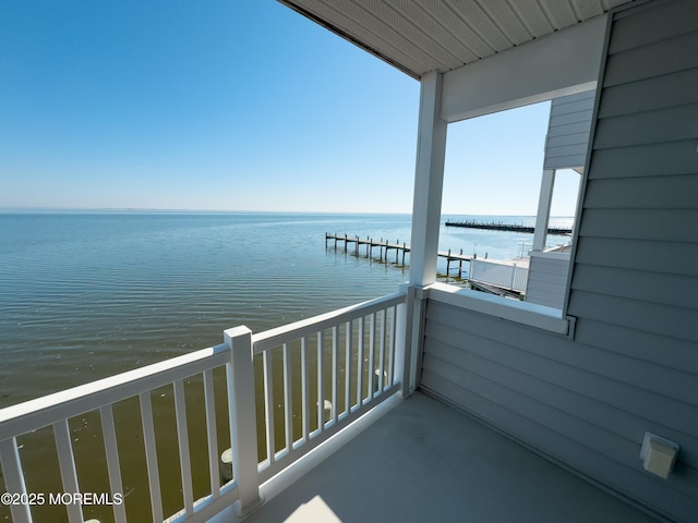 balcony featuring a water view