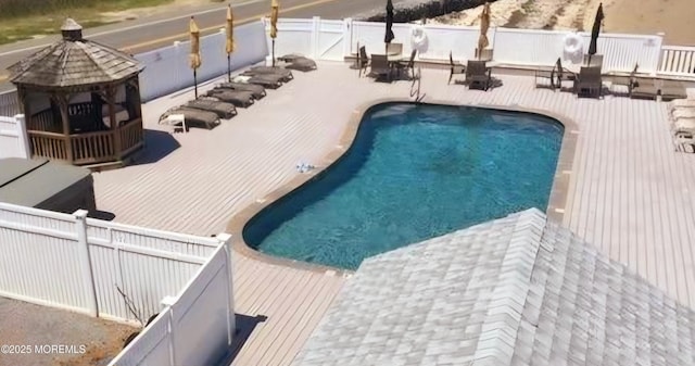 view of pool with a fenced backyard, a fenced in pool, and a patio