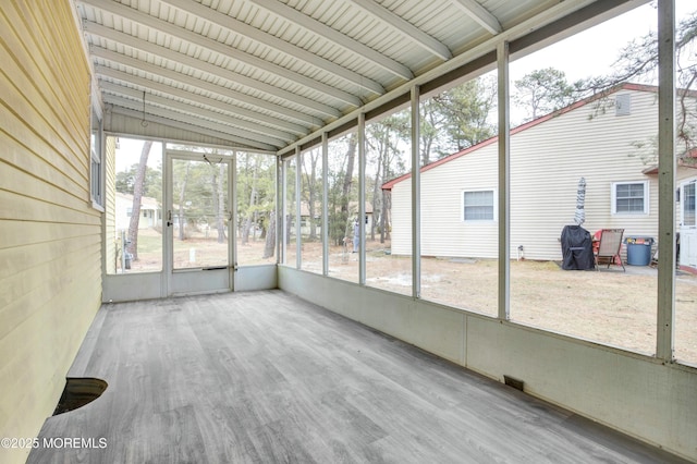 unfurnished sunroom featuring plenty of natural light