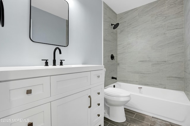 bathroom featuring toilet, bathtub / shower combination, and vanity