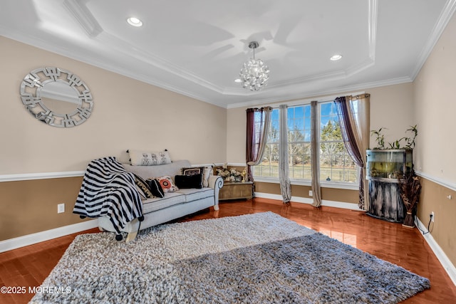 living room with a chandelier, recessed lighting, wood finished floors, baseboards, and crown molding