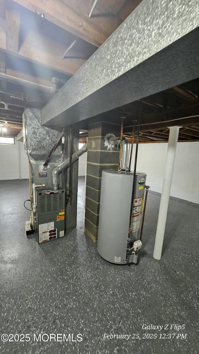 utility room with heating unit and water heater