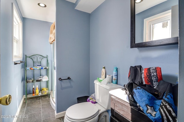 bathroom with recessed lighting, tile patterned flooring, toilet, and baseboards