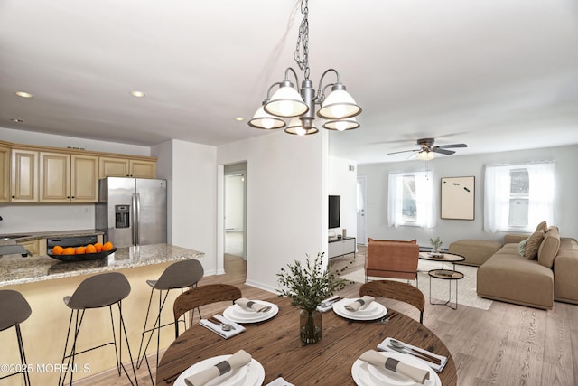 dining space with baseboards, ceiling fan, light wood-type flooring, and recessed lighting