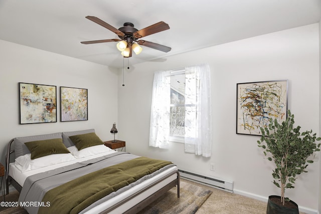 carpeted bedroom featuring baseboard heating, a ceiling fan, and baseboards