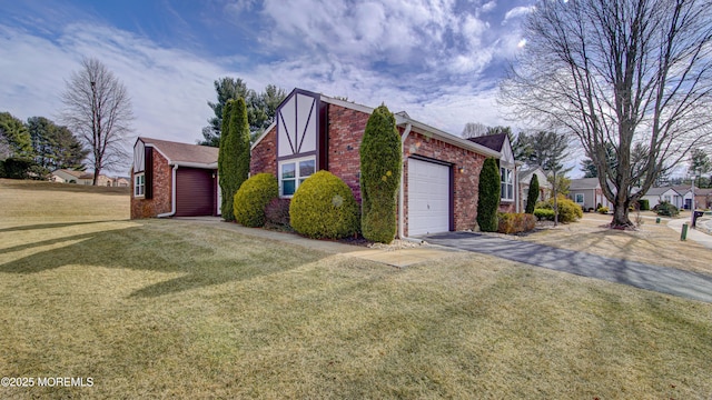 view of property exterior featuring driveway, brick siding, a lawn, and an attached garage