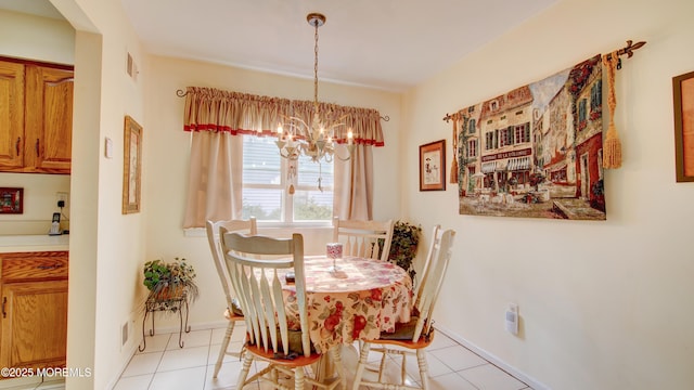 dining area with light tile patterned floors, visible vents, baseboards, and an inviting chandelier