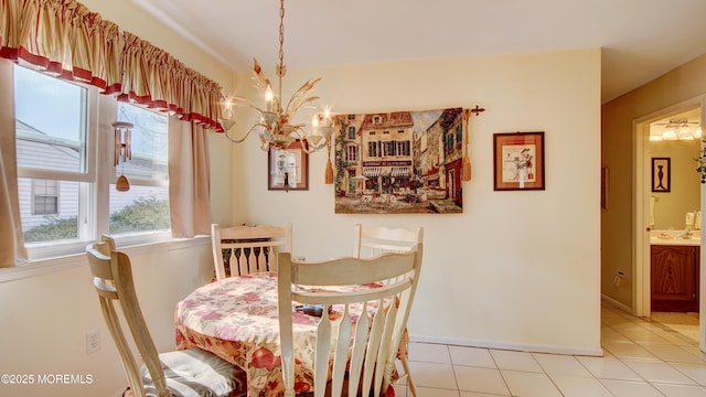 dining area featuring light tile patterned floors and a notable chandelier