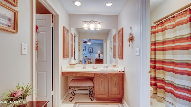 bathroom featuring curtained shower, toilet, recessed lighting, vanity, and a ceiling fan