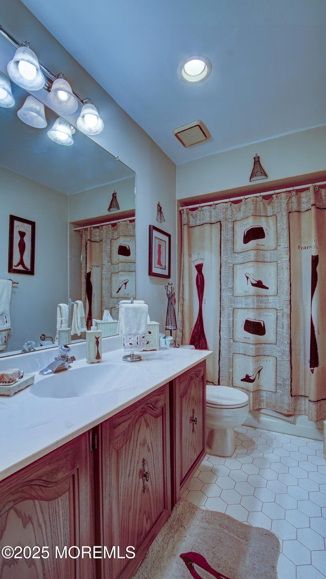 bathroom with toilet, tile patterned flooring, vanity, and a shower with curtain