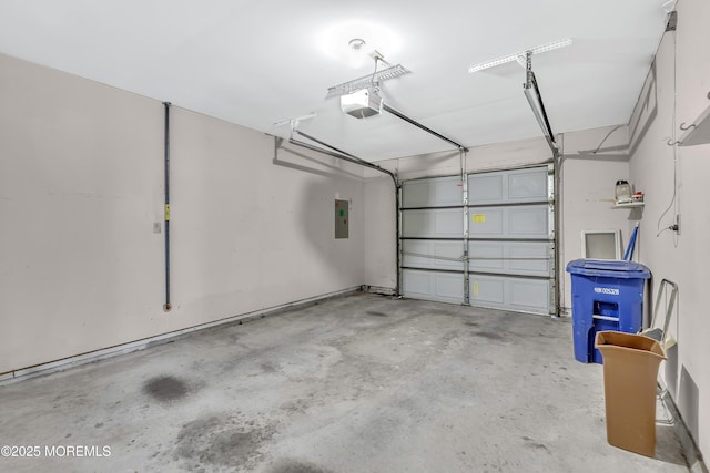 garage featuring a garage door opener and electric panel