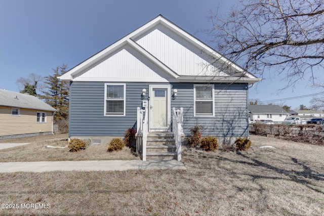 bungalow-style house with entry steps