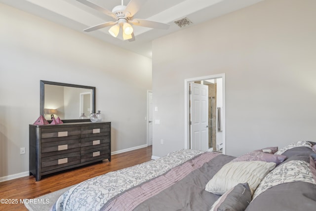 bedroom featuring a ceiling fan, baseboards, and wood finished floors