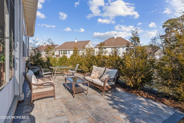 view of patio / terrace with a residential view and outdoor lounge area