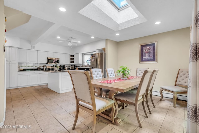 dining area featuring a skylight, light tile patterned floors, recessed lighting, visible vents, and ceiling fan