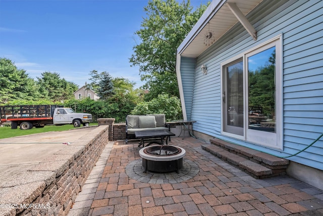 view of patio featuring an outdoor fire pit