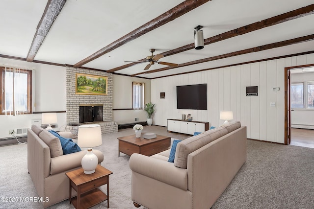 living room featuring a baseboard radiator, a brick fireplace, light carpet, ceiling fan, and beamed ceiling