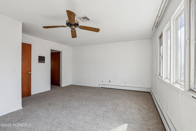 empty room with a baseboard radiator, light carpet, visible vents, a ceiling fan, and baseboard heating