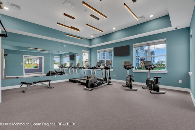 gym with baseboards, visible vents, and recessed lighting